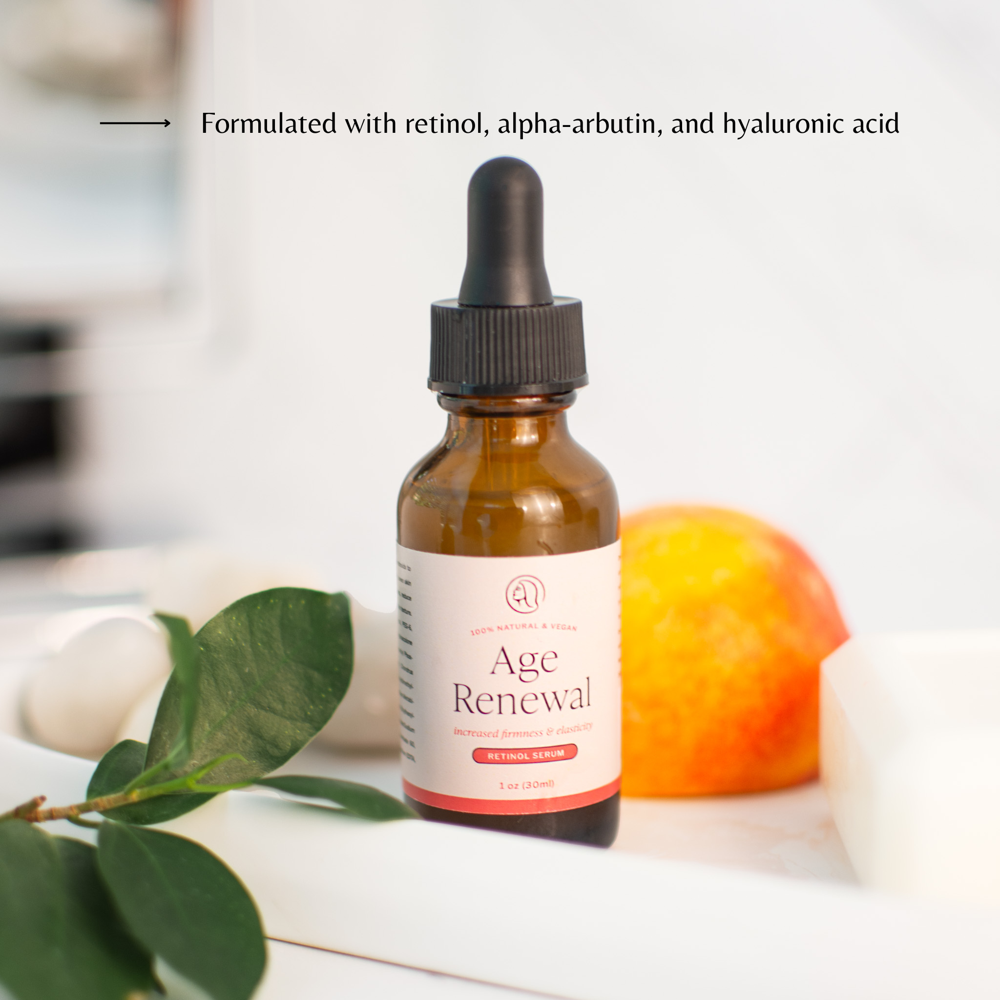 Age Renewal, retinol serum from Mavian Beauty placed with a peach